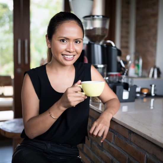 Lady enjoying Bali Coffee
